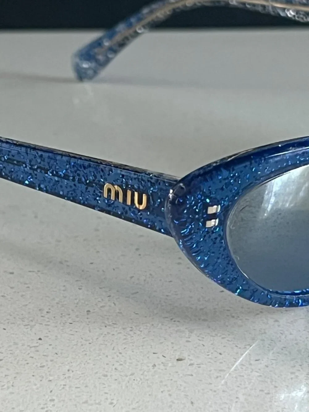 Miu Miu MU 09US 1452B2 blue glitter cat-eye sunglasses